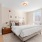 a bedroom with bed and nightstand