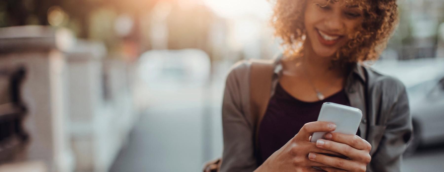 a woman holding a phone